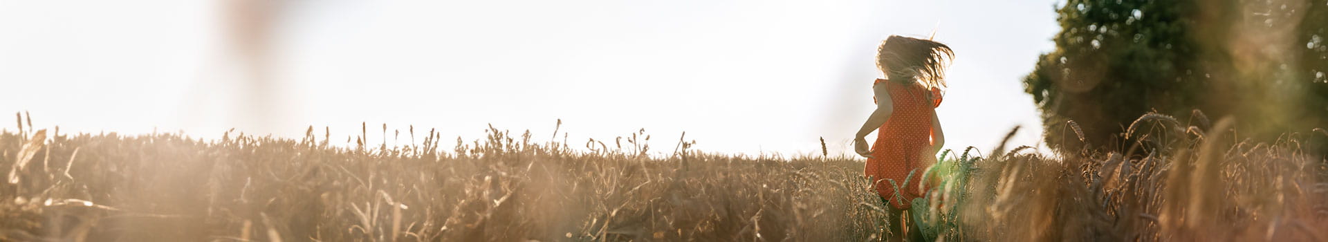 Girl running on field representing nedermans sustainability work