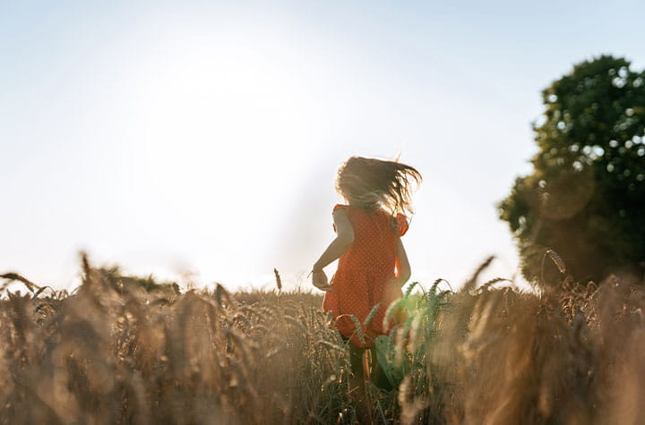 girl running on fields 